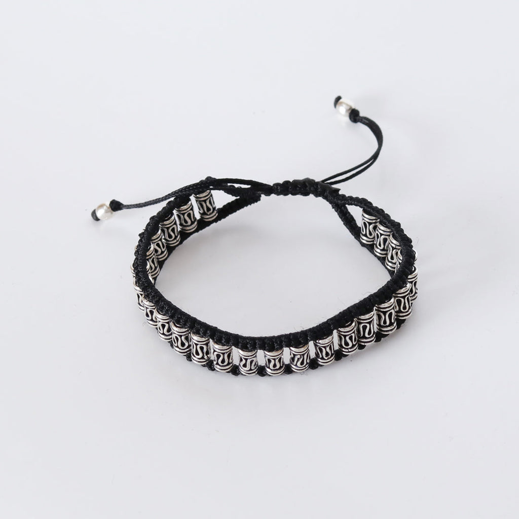 Elegant bracelet – handcrafted with silver motifs and black braiding