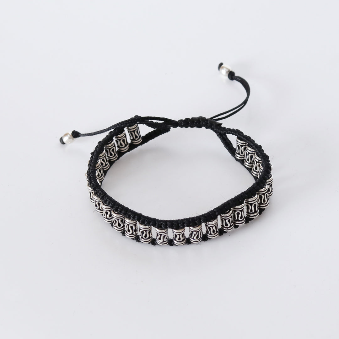 Elegant bracelet – handcrafted with silver motifs and black braiding